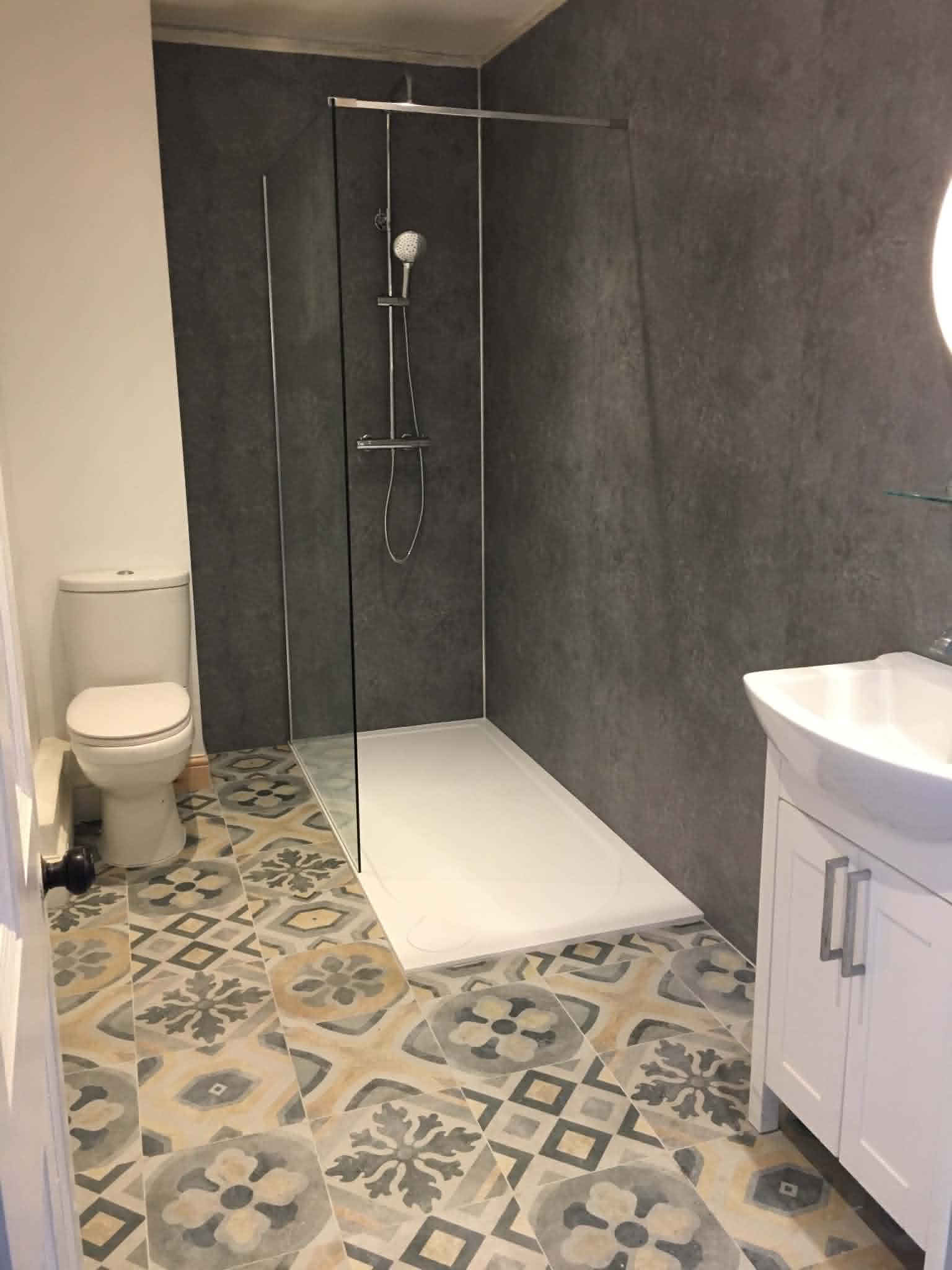 Wet room with patterned encaustic tiles